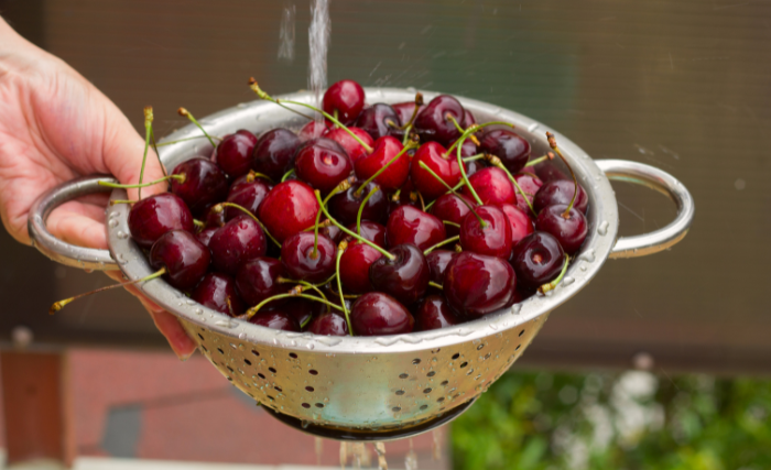 Image of Sort and wash fully ripe cherries; remove any stems, leaves,...