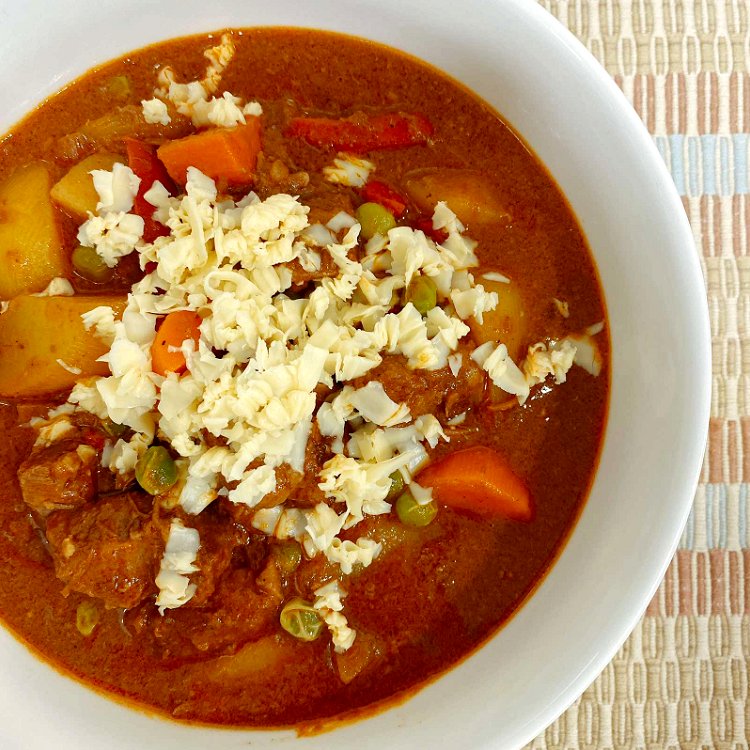 Image of Serve in a bowl and garnish with more cheese on...