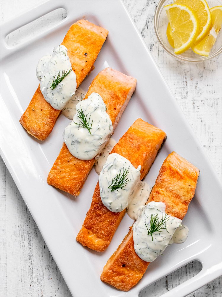 Image of Transfer cooked salmon to a serving plate and top with...