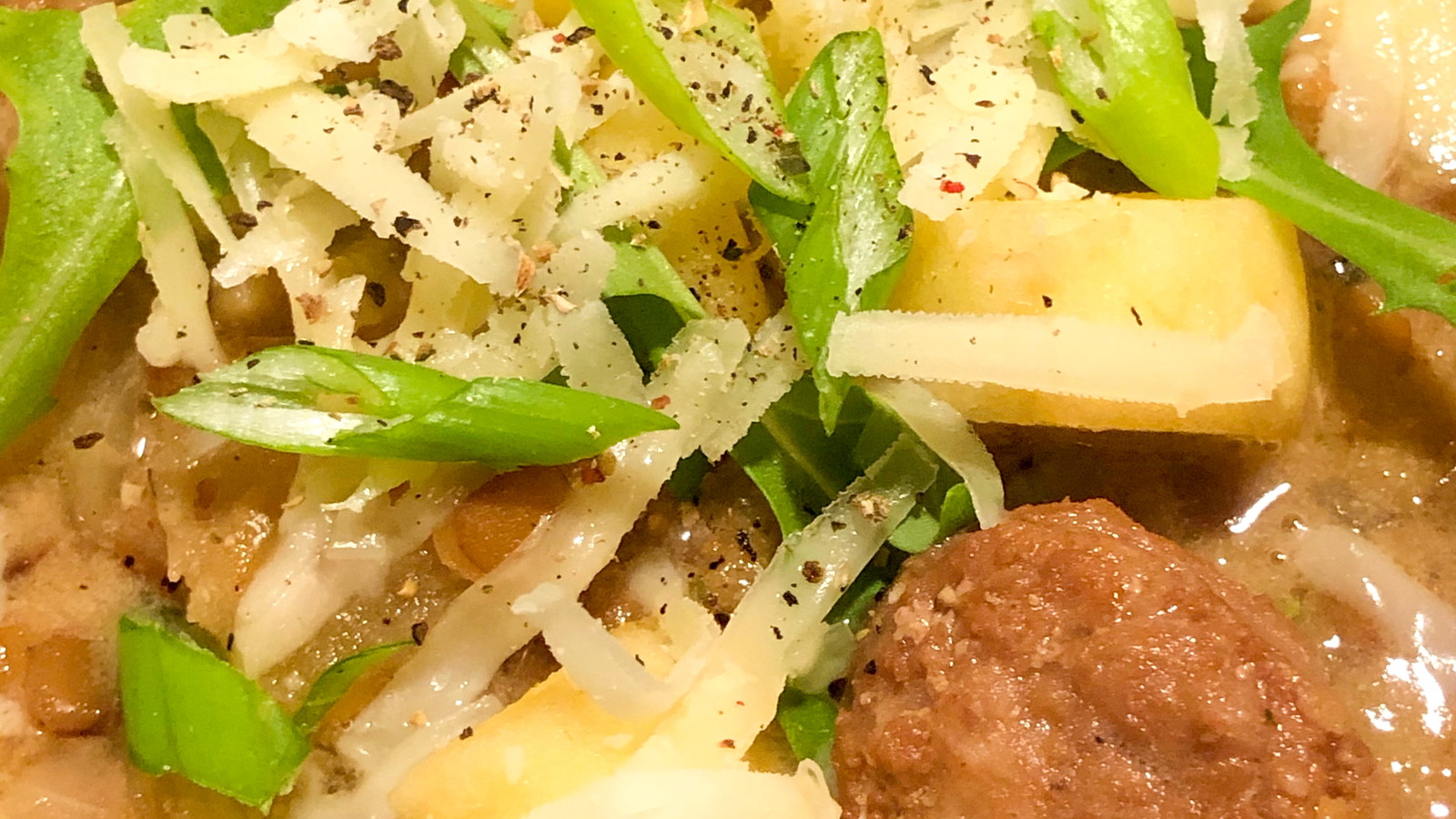 Image of Garlic Kraut Mustard Lentil Soup with Kielbasa, Apples, and Arugula