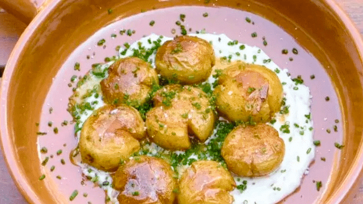 Image of Smashed Potatoes with Garlic Confit Creme Fraiche