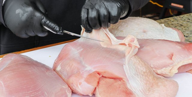 Image of Remove the skin from the turkey breast and trim away...