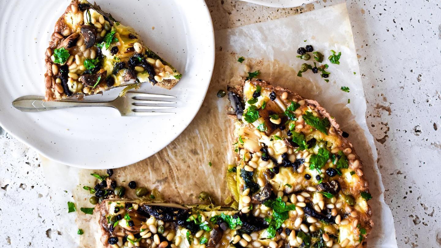 Image of Truffled Mushroom, Leek, Silverbeet & Goat Cheese Quiche (with pine nuts and caper currant sprinkle)