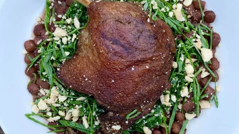 Image of Duck Confit over Beans with Spring Onion, Kale Salad