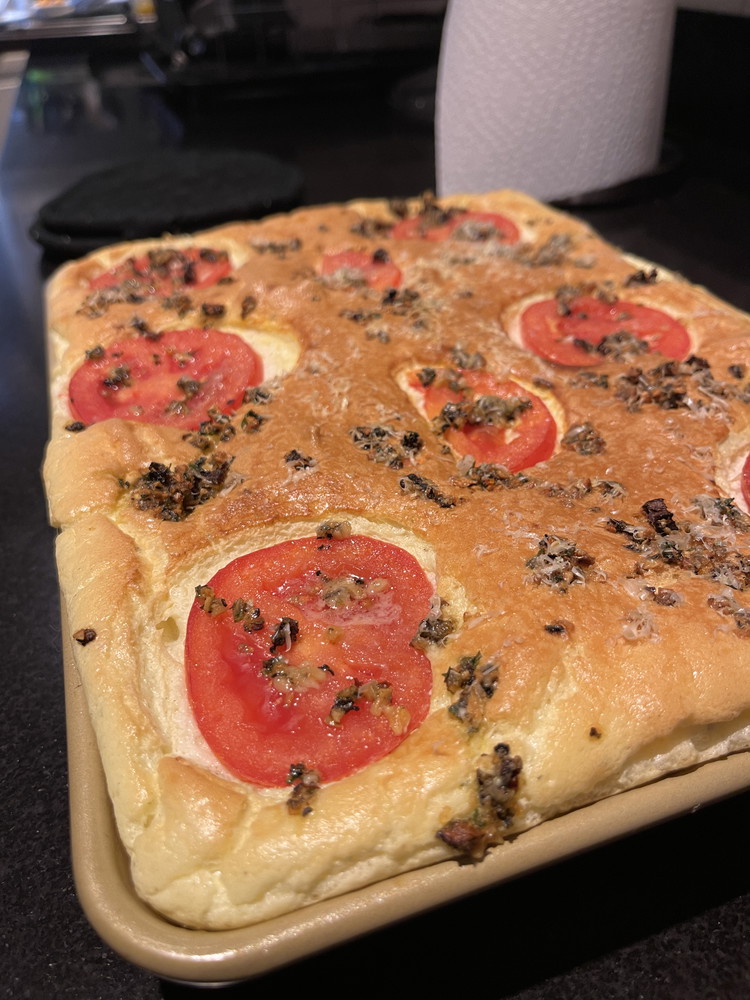 Image of Sprinkle with Tuscan Fantasy Seasoning and Parmesan Cheese. Bake for 10 minutes and then rotate the pan in the oven (to promote equal browning). Bake an additional 10-15 minutes until the bread is golden brown and fluffy- if the bread...