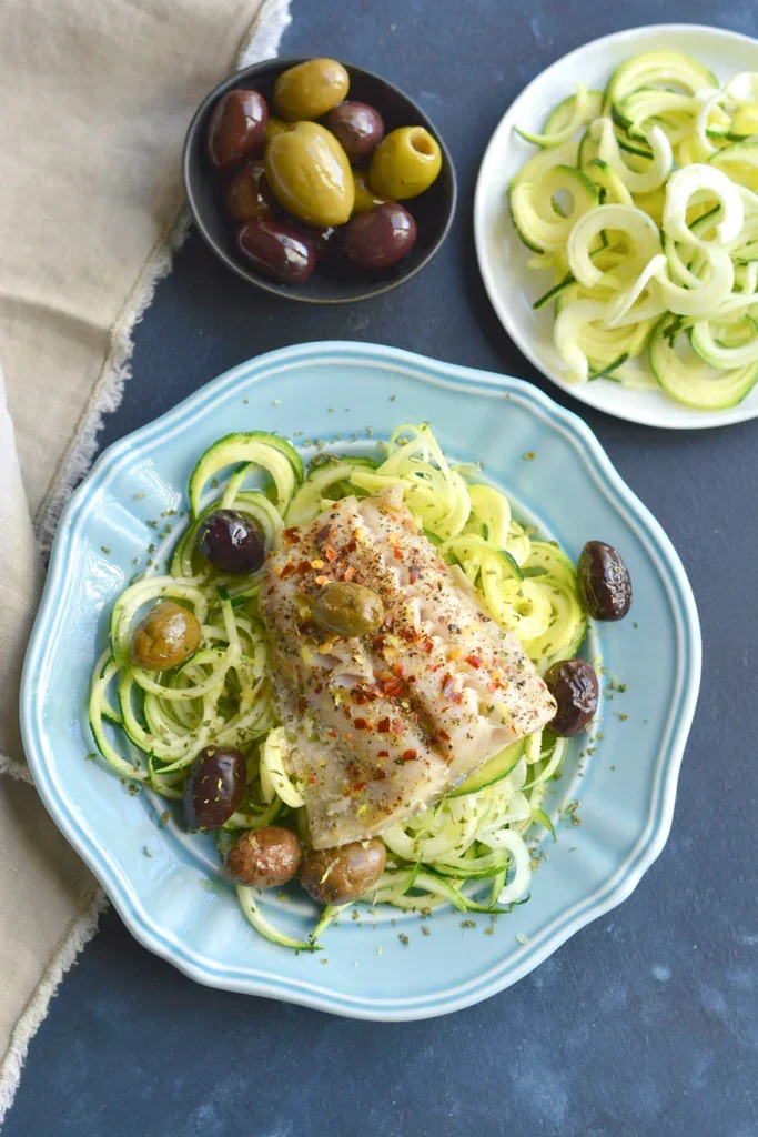 Image of Serve the zucchini noodles with the fish and olives immediately.
