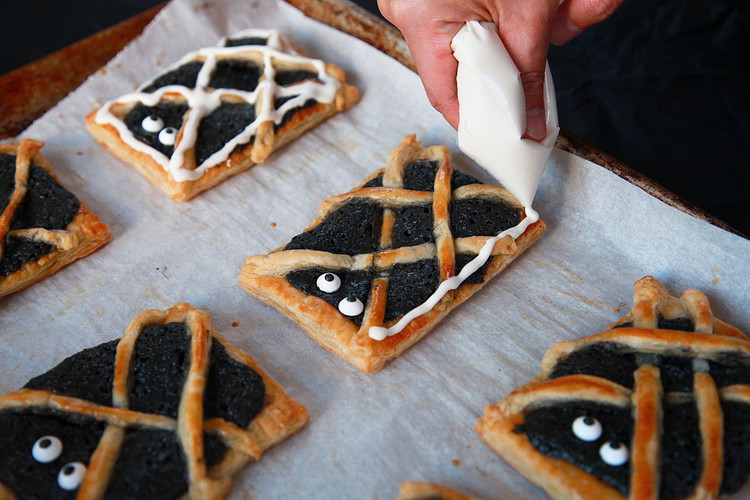 Image of To make the glaze, whisk the powdered sugar, salt, and heavy cream. The glaze should run thick and very slowly. You may adjust by adding more heavy cream by the teaspoon. Use a piping bag or zip lock bag with...