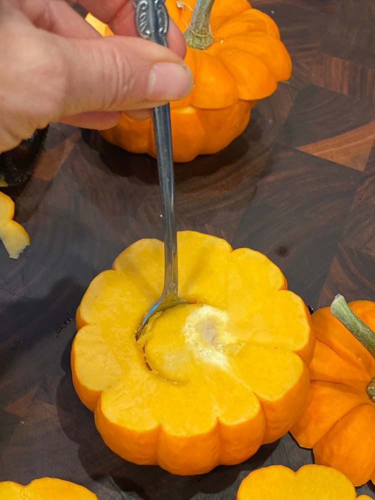 Image of Cut off the top of each mini pumpkin. Usually this...