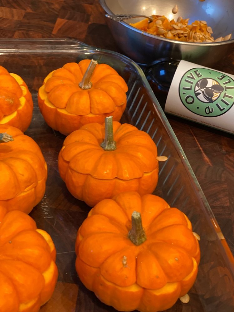 Image of Place pumpkins into baking dish with sides. Fill baking dish...