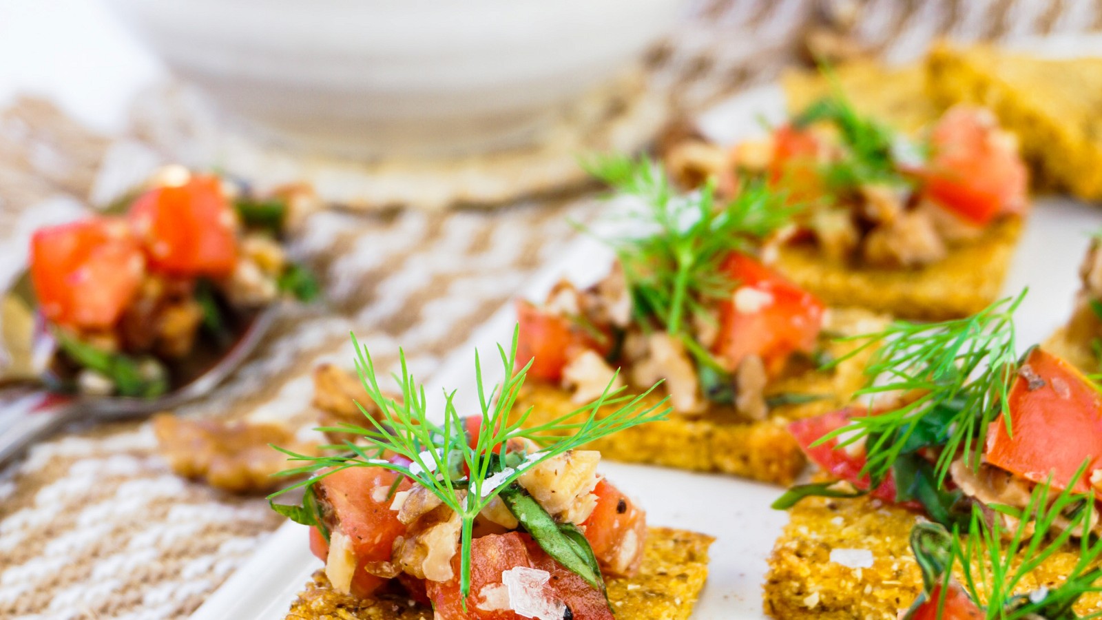 Image of Crispy Polenta Bites With A Fresh Tomato And Walnut Topping