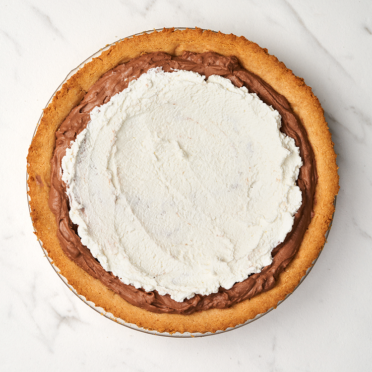 Image of Whipped Topping: Whip the remaining heavy cream with 1 tsp vanilla extract and 1 Tbsp Lakanto Baking Sweetener. Dollop whipped topping onto the pie.
