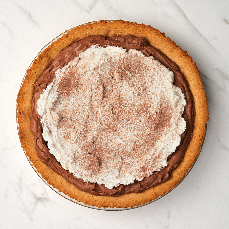 Image of Dust with cocoa powder. If you're going the extra mile, carve chocolate curls from a Lakanto Chocolate Bar, or simply break chocolate into pieces and arrange on top. Get ready to impress your friends and family and enjoy!