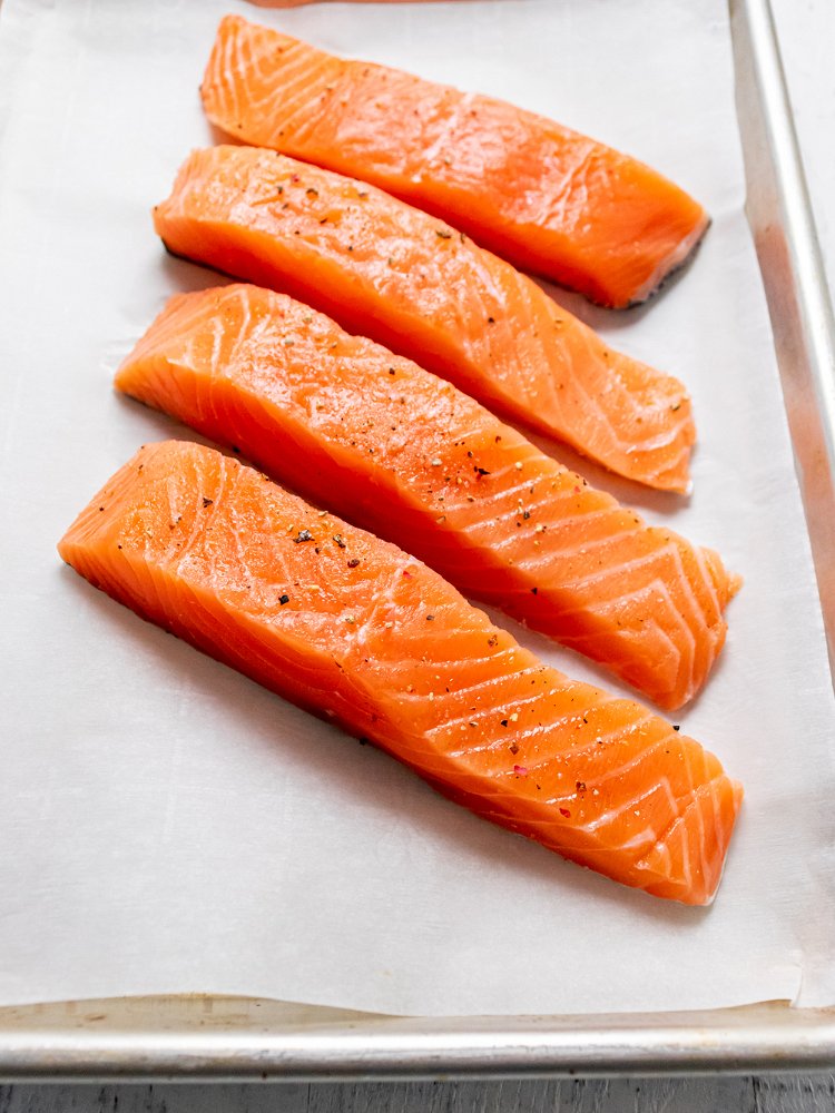 Image of Blot salmon dry with paper towel and place on a...