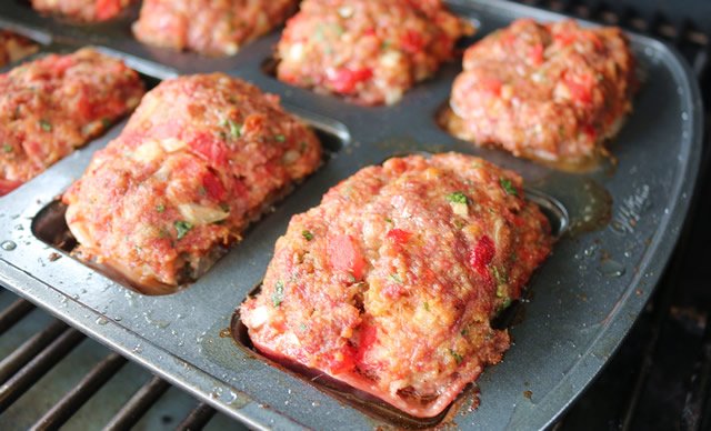 Image of Carefully remove each mini meat loaf from pan and place...