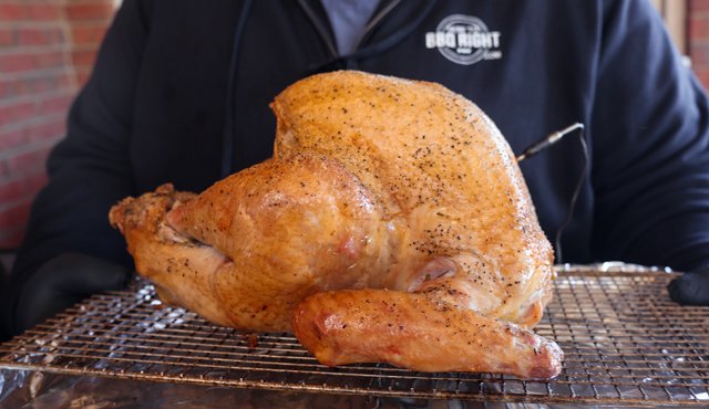 Image of Remove the turkey from the smoker and insert the turkey...
