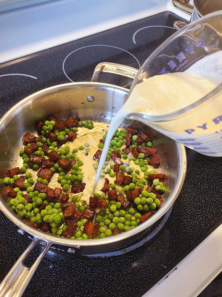 Image of Add your peas and then your cream, lower the heat...