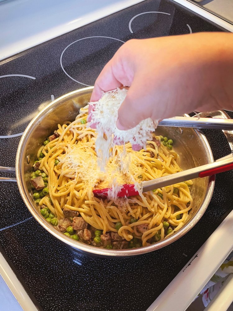 Image of Add your parmigiano with your pasta and toss to combine.