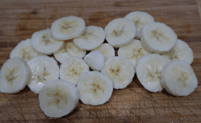 Image of Peel and slice the bananas one at a time (¼...