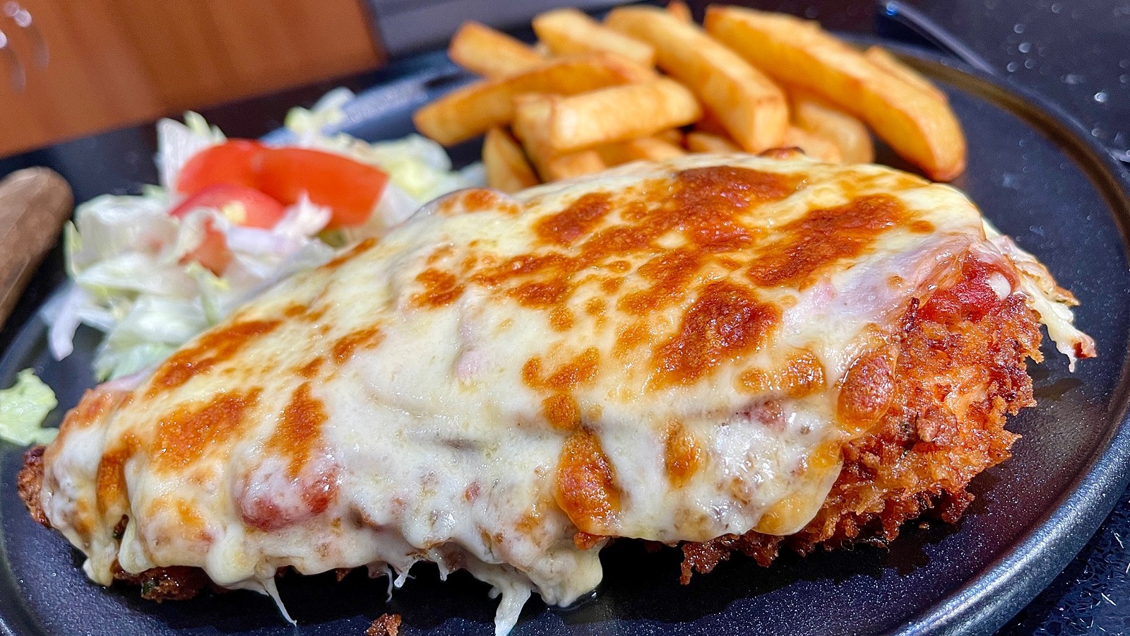 chicken parmigiana with panko crumbs and pizza cheese