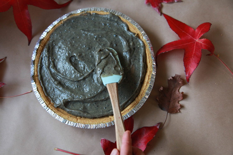Image of Top with whipped cream and garnish with wafer crumbs and black sesame seeds.