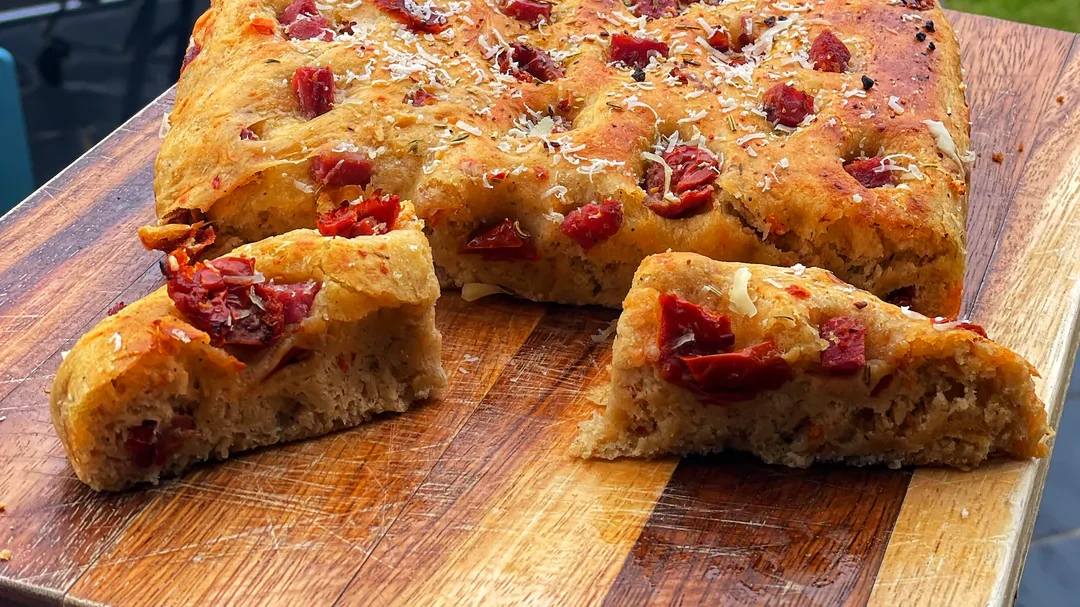 Image of Garlic & Herb Focaccia topped with parmesan, salami milano & sundried tomatoes 