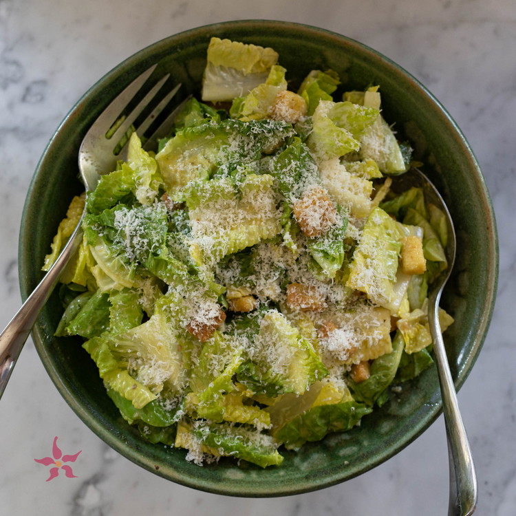 Image of Fill anchovy-y mason jar with grapeseed oil and extra virgin olive oil. Shake again for another 30 seconds, until oil is emulsified. Fill mason jar with croutons, and let sit for 2-3 minutes to soften slightly. 