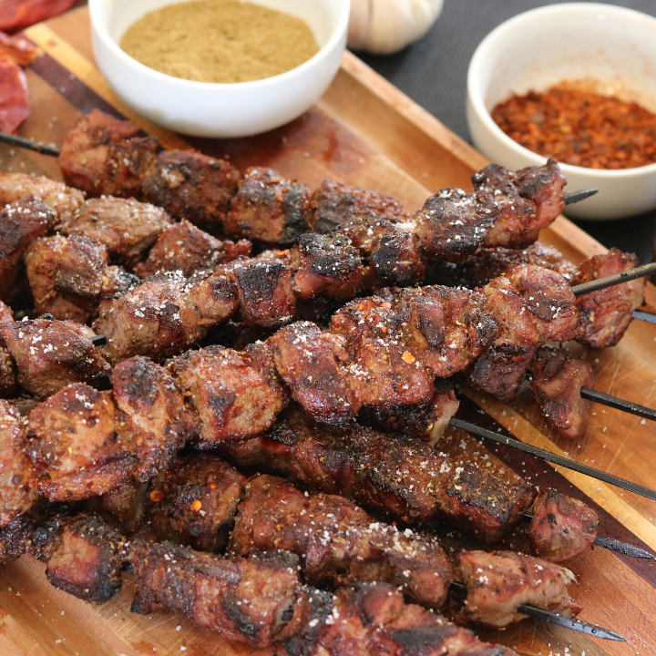 https://images.getrecipekit.com/20221128110151-how-to-make-xin-jiang-lamb-bbq-skewers-recipe.png?aspect_ratio=1%3A1&quality=90