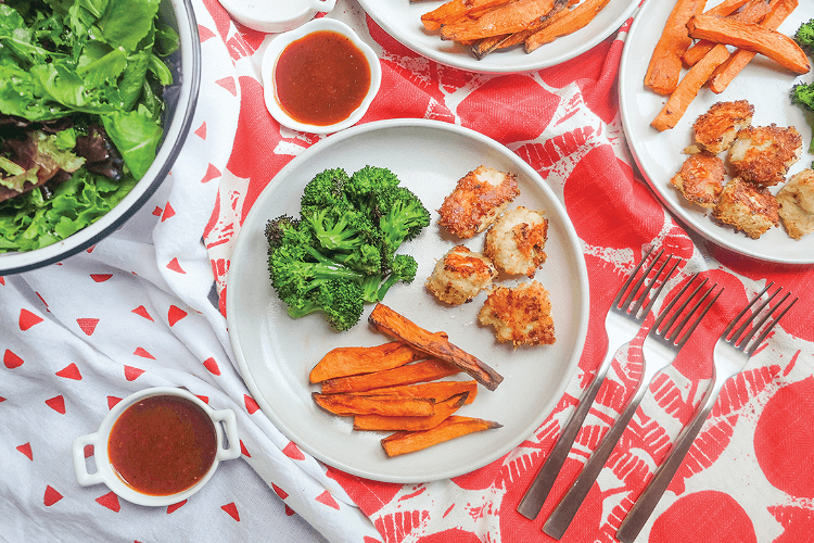 Image of Serve the chicken nuggets accompanied by the fries and  the...