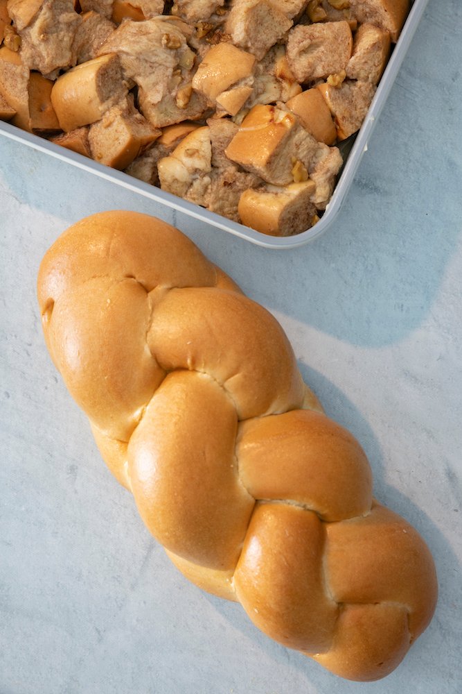 Image of Add the challah cubes and walnuts. Stir to coat evenly.