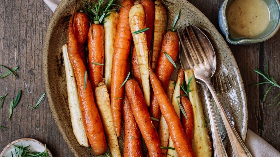 Image of Honey roasted carrots & parsnips with garlic tahini drizzle