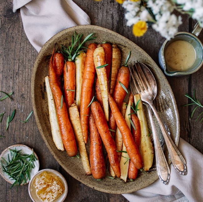 Image of Honey roasted carrots & parsnips with garlic tahini drizzle
