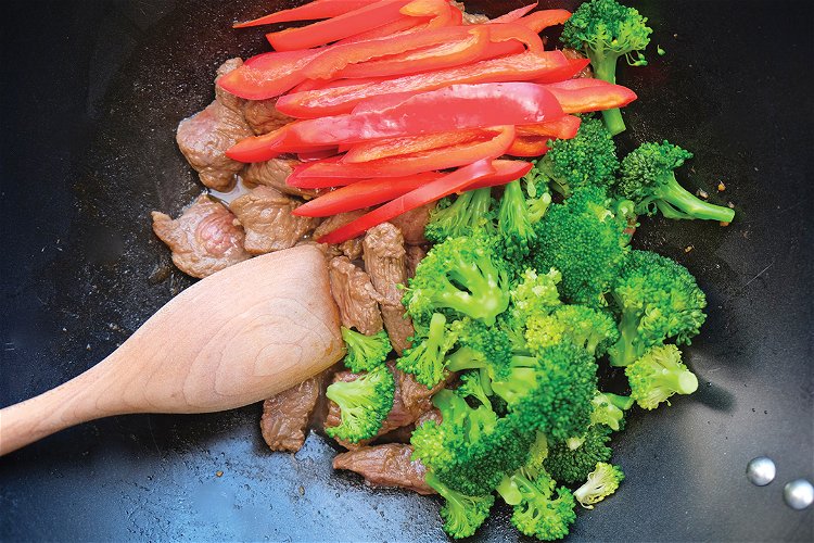 Image of Add the broccoli and the red pepper and cook for another...