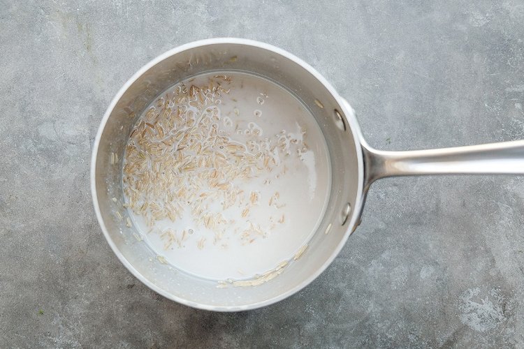 Image of Combine the coconut broth, 1.5 cups per cup of rice,...