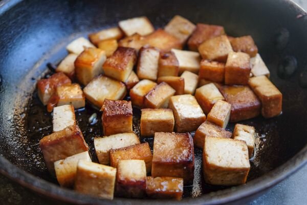 Image of Place the tofu on a baking sheet in a single...