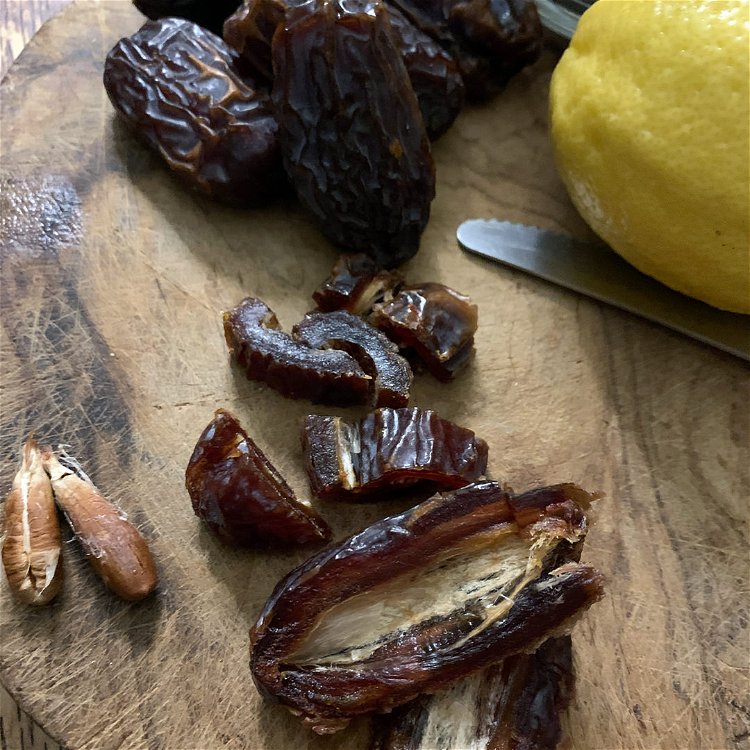 Image of Remove pits from Medjool dates, and chop them to smaller...