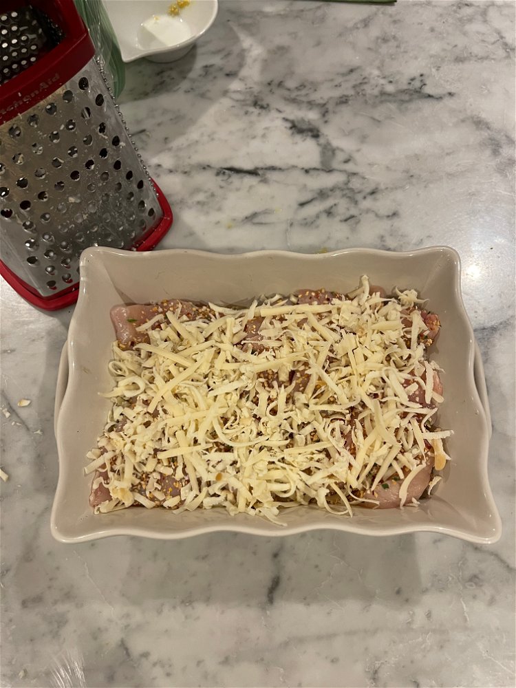 Image of Sprinkle the cheese over the chicken and then with the...