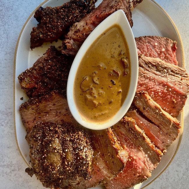 Image of Bone-In Rib Roast and Mushroom Au Poivre Sauce