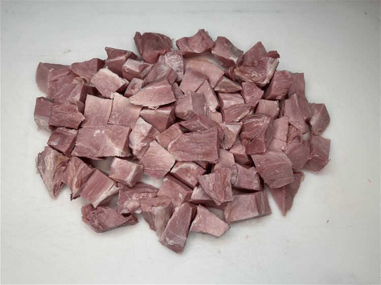 Image of Cut the ham into large 2” pieces. Then toss the...