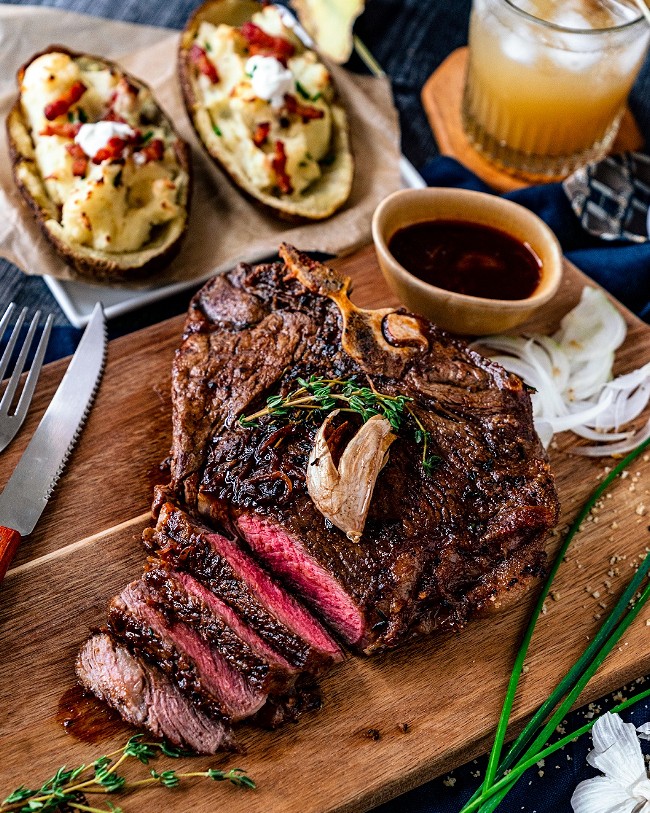 Image of Roasted Porterhouse Steak with Twice Baked Potato and Black Truffle Jus