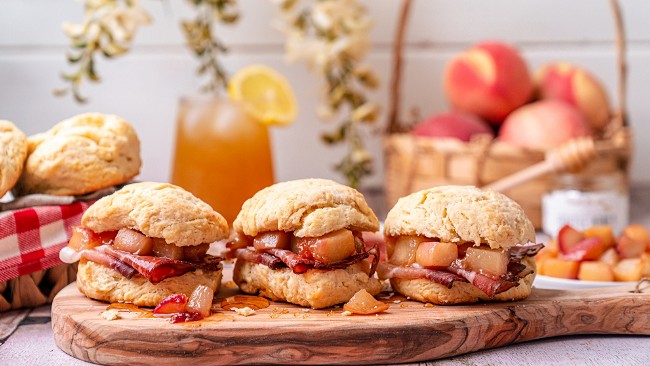 Image of Bentonâs Ham Biscuits with Golden Peaches and Brown Butter Truffle Honey