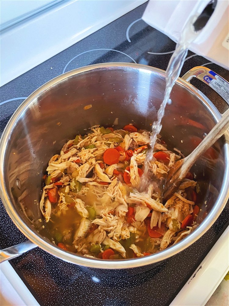 Image of Add chicken broth and bring to boil. Reduce heat to...