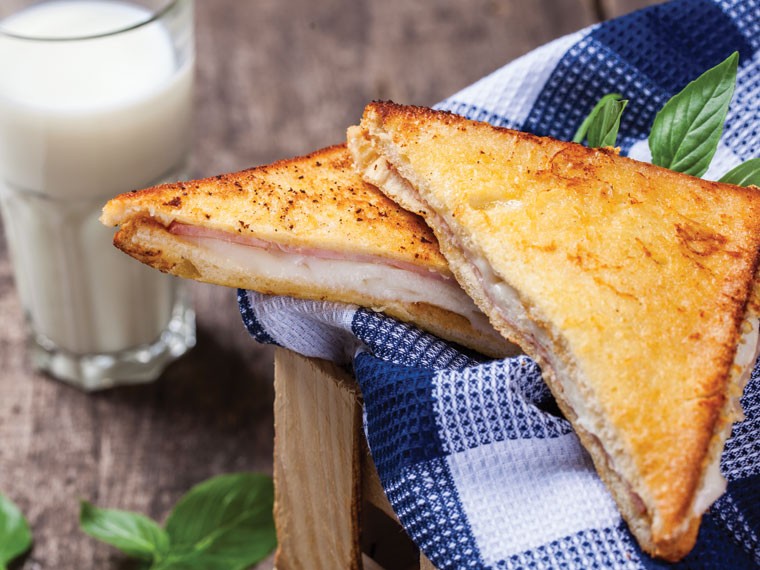 https://images.getrecipekit.com/20221220205510-grilled-ham-and-cheese-02.jpg?aspect_ratio=4:3&quality=90&