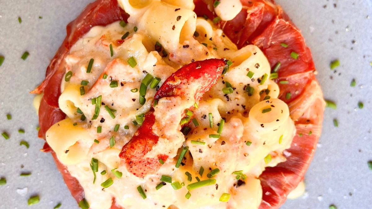 Image of Smoked Prosciutto-Wrapped Brie with Lobster Mac and Cheese