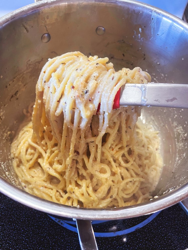 Image of Add pasta back to pot and quickly combine with tongs,...