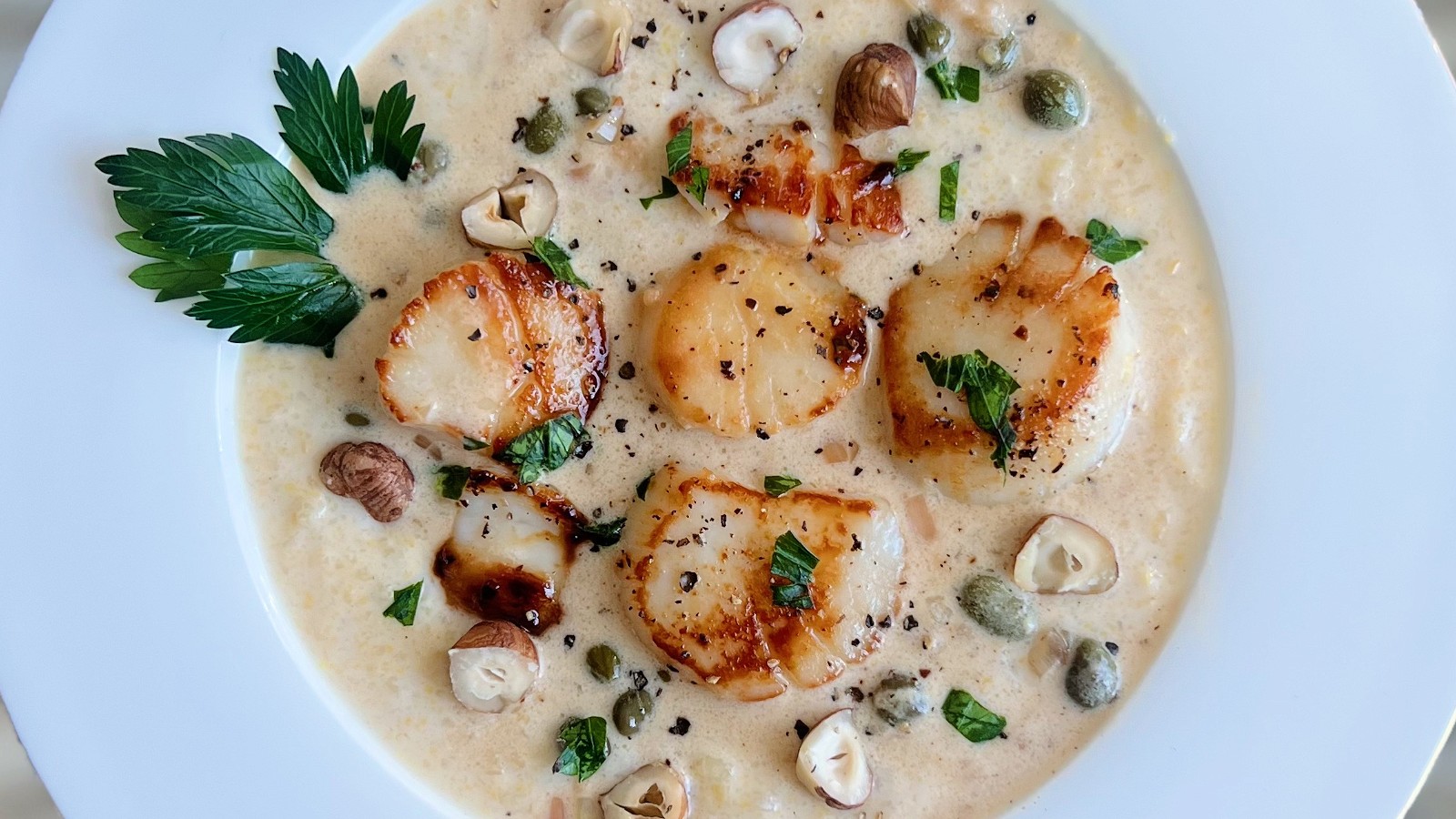 Image of Seared Scallops over Creamy Polenta