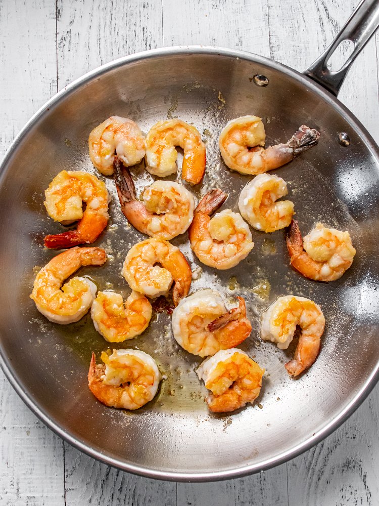 Image of Sprinkle shrimp with flour and toss to coat. Pan fry...