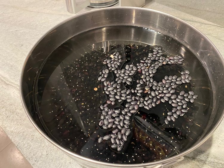 Image of Soak black beans overnight in a bowl covered with water....