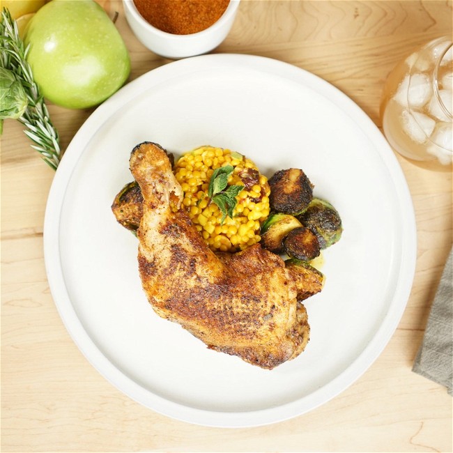 Image of Moroccan Chicken with Truffle Honey, Saffron Couscous, & Charred Brussels Sprouts