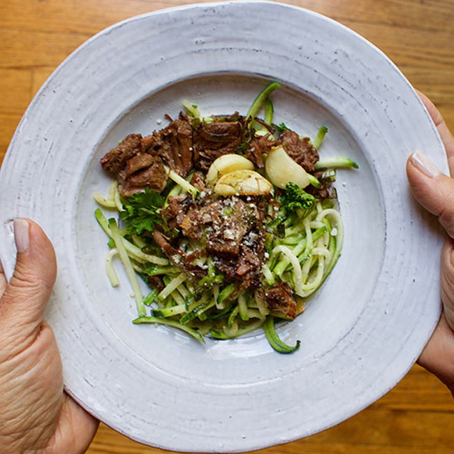 Image of braised beef and garlic over zucchini noodles