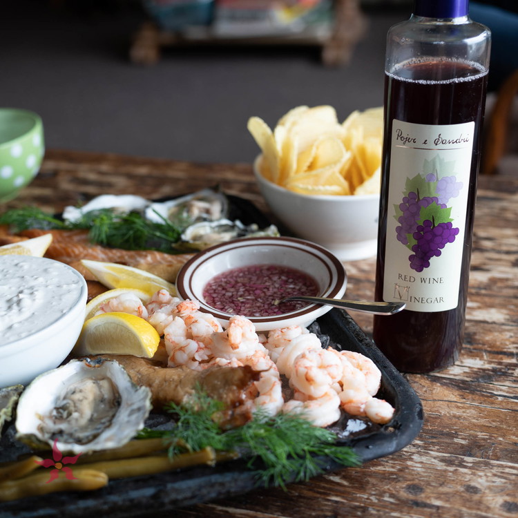 Image of To make the mignonette, combine shallots, vinegar, salt and pepper in a small bowl.